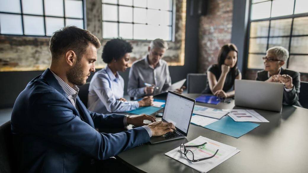 Businessman using a laptop at a office Businessman using a laptop at a office