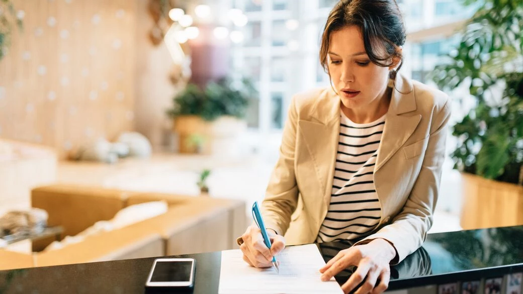 Woman making checklist Woman making checklist
