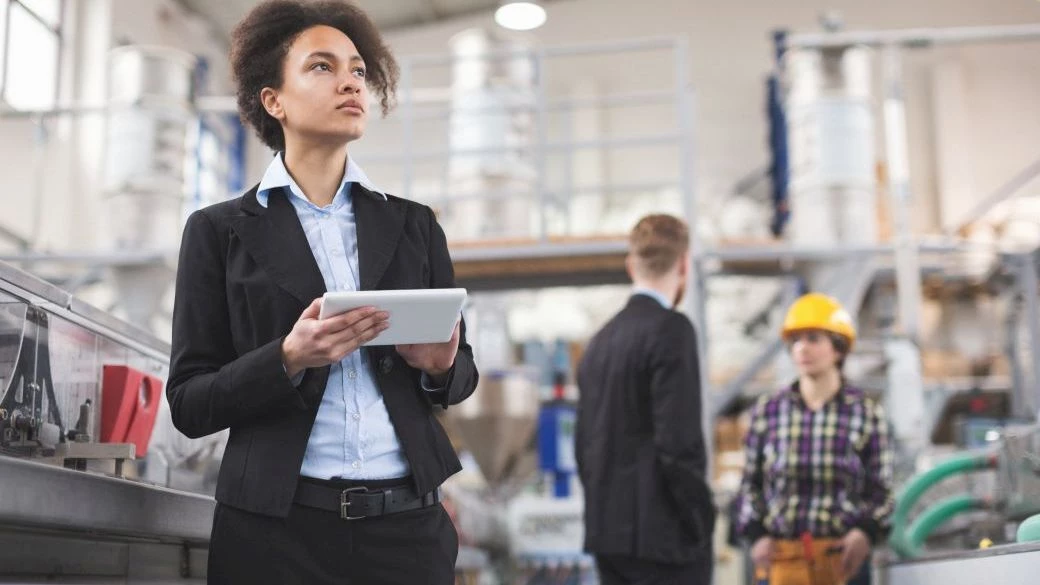 Quality Inspector using a tablet at factory Quality Inspector using a tablet at factory